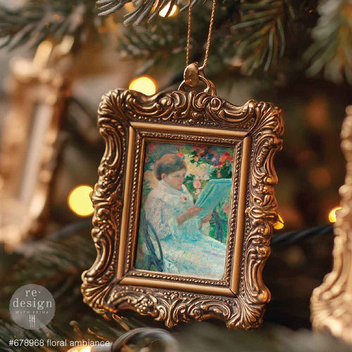 Redesign with Prima transfer A4 Floral Ambiance. Decorative ornament with vintage-style frame and painting inside, hanging on a Christmas tree.