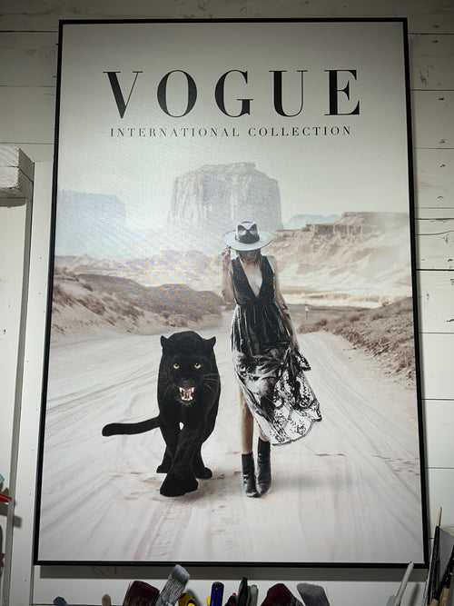 Framed Vogue magazine cover with a woman and panther in a desert setting