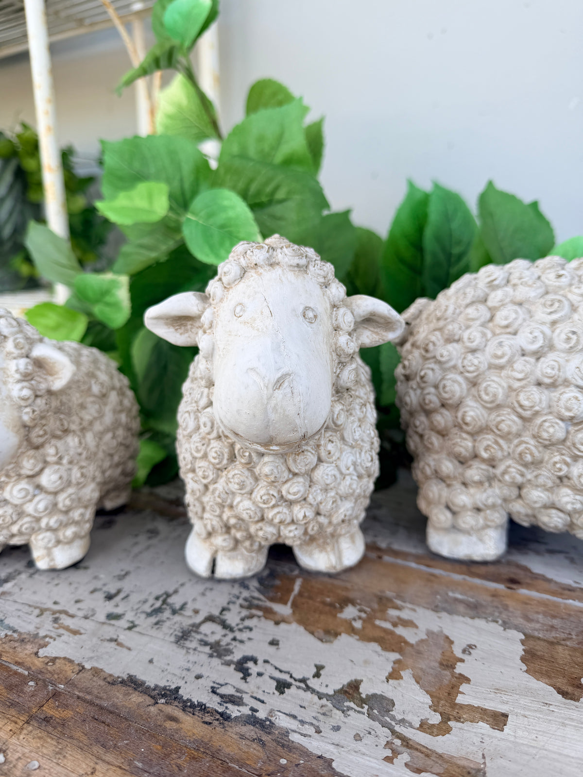 textured sheep figurine in a distressed off-white concrete finish