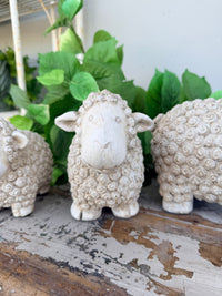 textured sheep figurine in a distressed off-white concrete finish