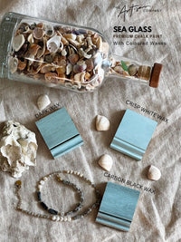 Sea glass premium chalk paint with colored waxes displayed on a textured surface.