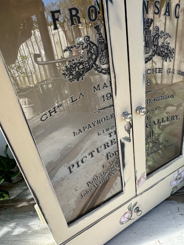 Decorative mirror with vintage-style text and design on a neutral background Vintage look Jewel Box with doors