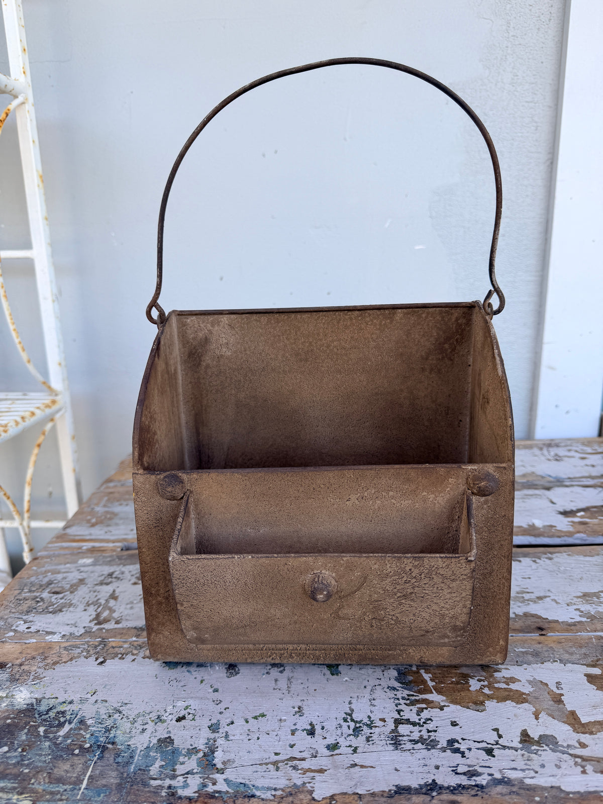 Rusty metal trug with handle