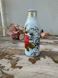 Painted glass mini milk bottle Blue w red and black floral