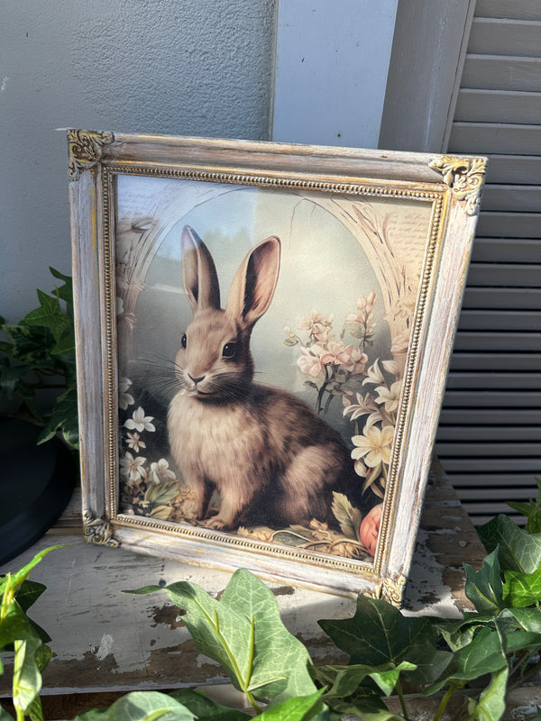 Framed artwork of a rabbit with floral elements on a gray surface. Bunny Artwork