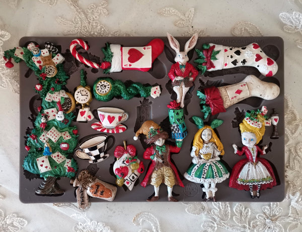 Collection of decorative figurines inspired by Alice in Wonderland on a dark surface. Whimsical Holiday Dreams Mould by Redesign with Prima