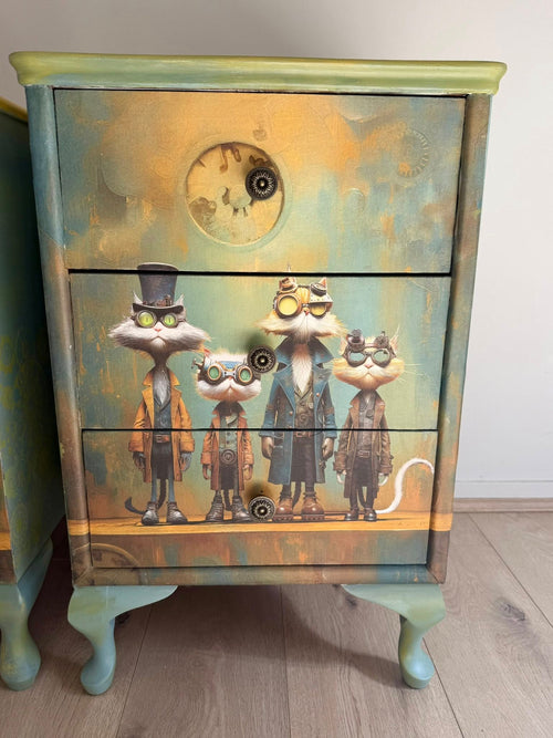 Four animated cat characters in vintage outfits and goggles against a stylized moon and starry sky . 
Suspicious Motives | Dandy Cat Portraits Decoupage Paperbackground.