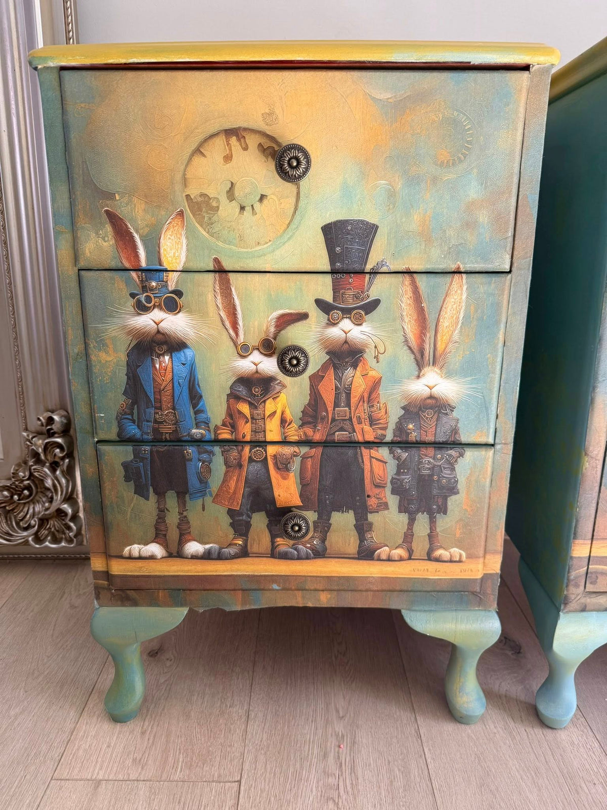 Four animated rabbits in vintage clothing standing on a wooden surface with a decorative background. Uncertain Intent Mulberry Decoupage Paper