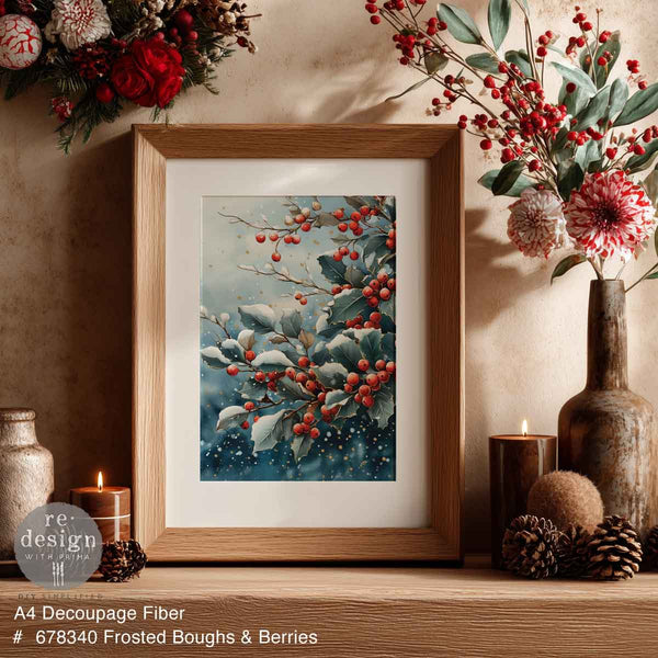 Frosted Boughs & Berries Mulberry Tissue Paper for Decoupage A4 1 sheet, Framed artwork of frosted boughs and berries on a decorative shelf with flowers and candles.