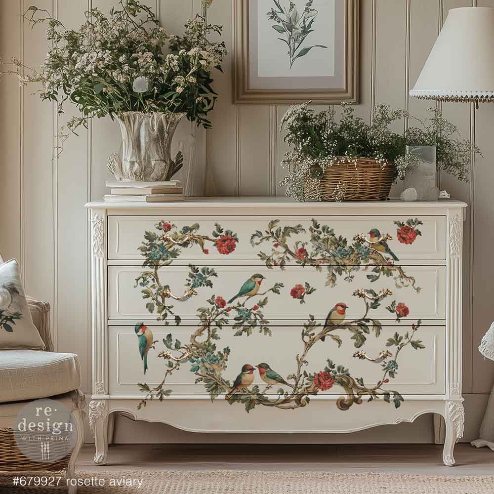 Redesign transfer Large Rosette Aviary. Decorative chest of drawers with floral and bird patterns in a room setting.