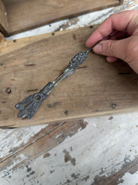 Old decorative tongs