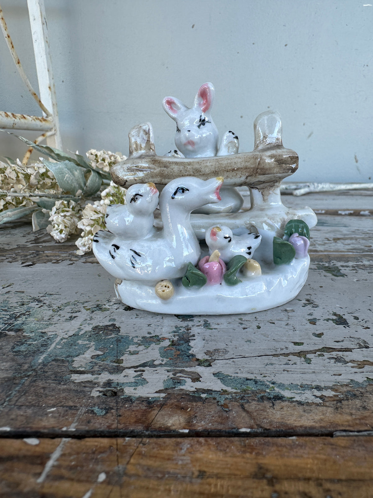 Bunny and ducks on fence