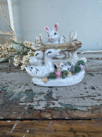 Bunny and ducks on fence