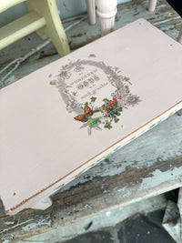 Low pink wood riser stool with Butterfly