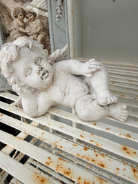Old aged chippy Cherub statue