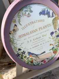 Oval framed bird w typography and flowers