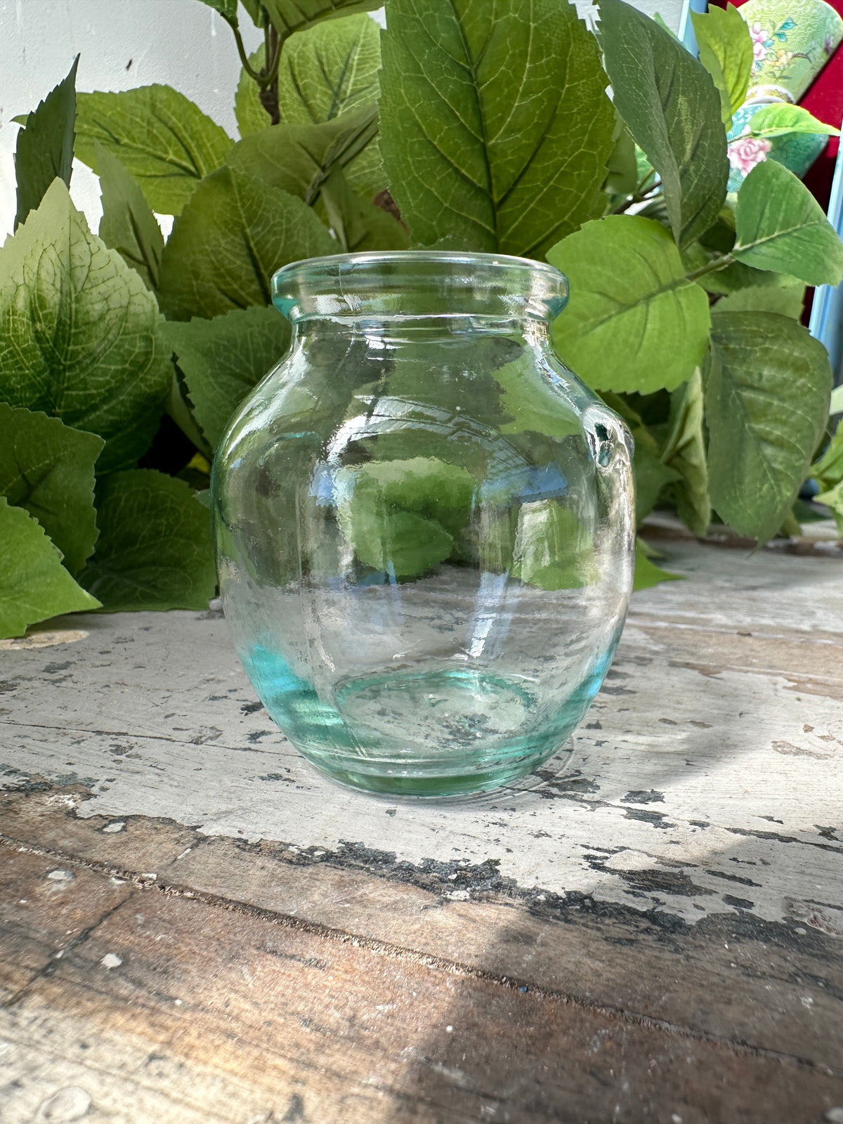 Small glass bottle with handle nubs