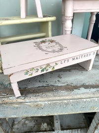 Low pink wood riser stool with Butterfly