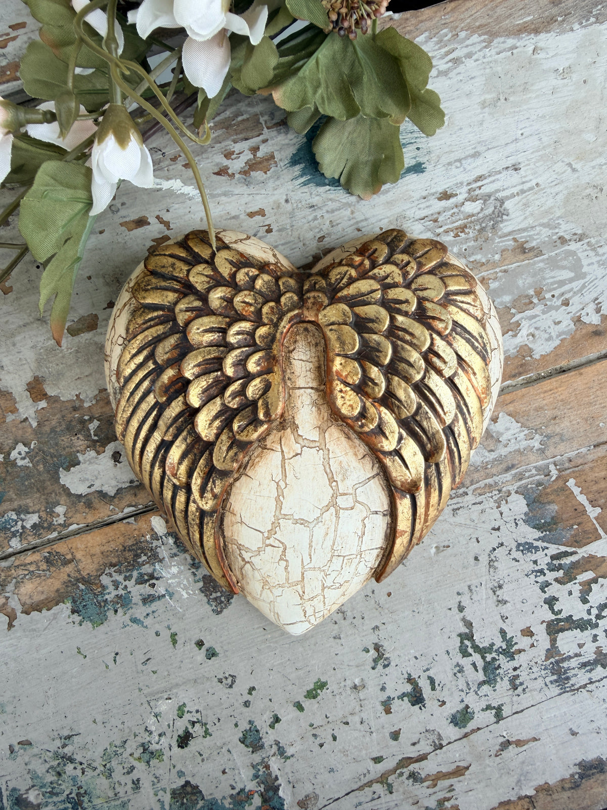 Wall heart Gold Angel Wings on cracked wall
