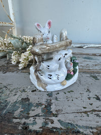 Bunny and ducks on fence