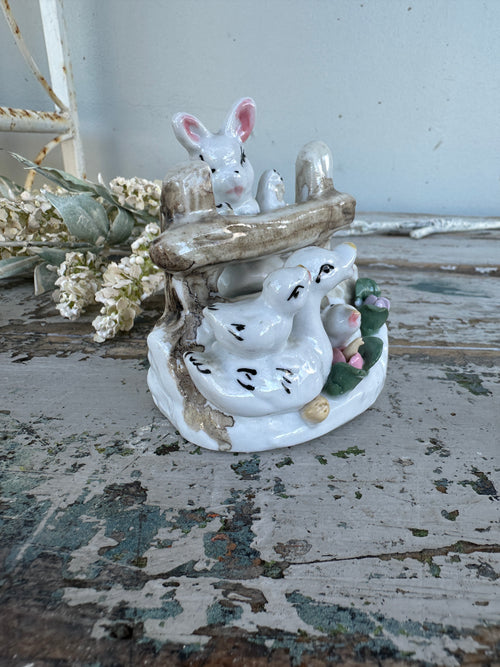 Bunny and ducks on fence