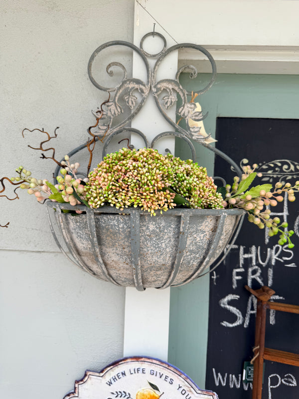 A rustic French grey metal hanging planter with intricate filigree design, .