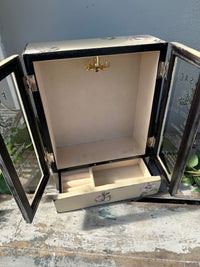 Open jewelry box with a gold clasp on a textured surface Vintage look Jewel Box with doors