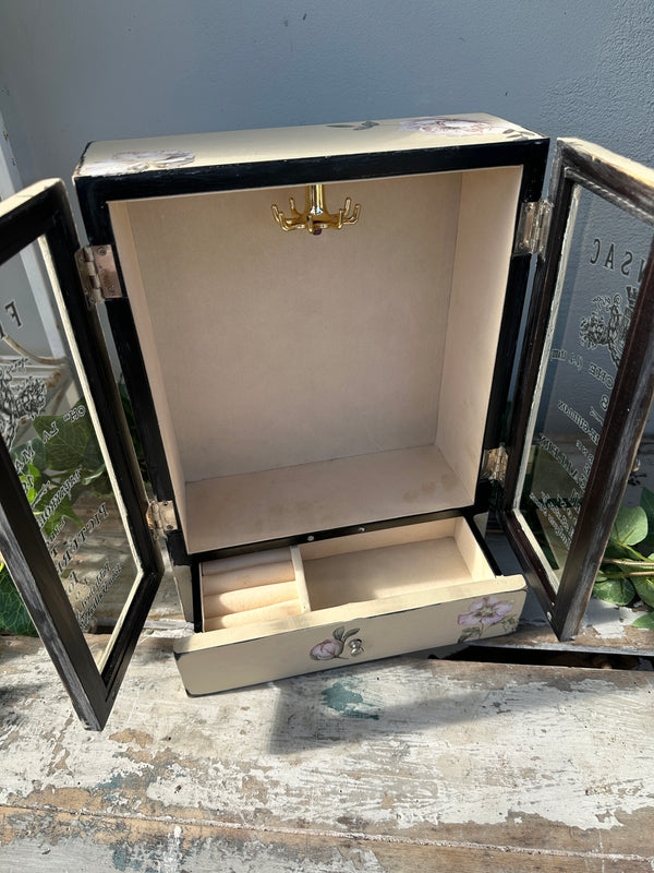 Open jewelry box with a gold clasp on a textured surface Vintage look Jewel Box with doors