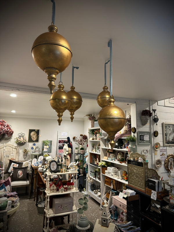 Vintage store interior with gold pendant lights and various decor items. Giant oversized Rustic Gold Metal hanging Finial small