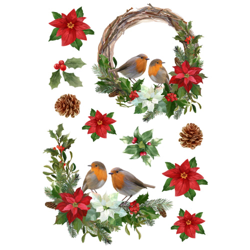 A Christmas-themed decorative wreath and scattered holiday elements on a white background, including a grapevine wreath with two robins, red poinsettias, holly leaves, pinecones, and small red berries.