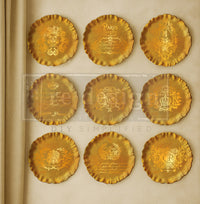 Set of gold decorative plates with intricate designs on a beige . Contours of Grace Mould by Redesign with Primabackground