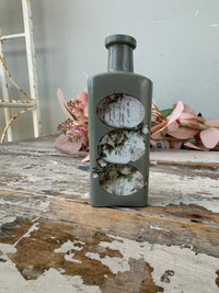 Painted glass bottle Newell w Eggs