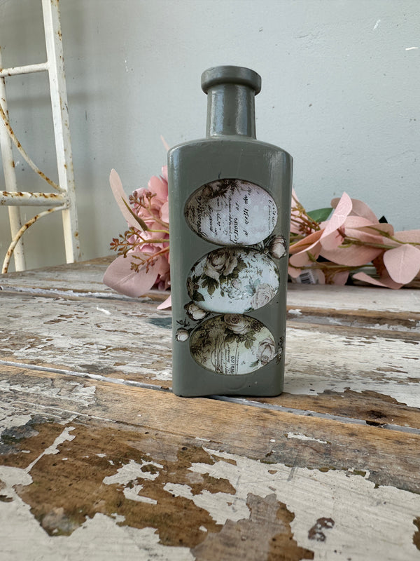 Painted glass bottle Newell w Eggs