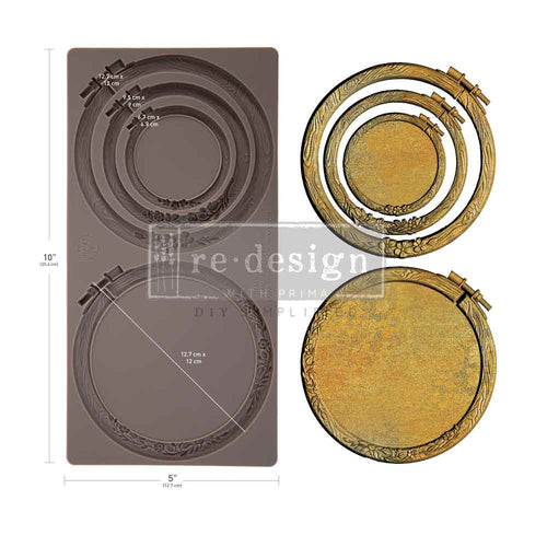 Silicone mould DIY with engraved concentric circle patterns and two matching circular metal hoops , like embroidery hoops. Artisan's Frame Mould by Redesign with Prima