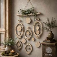 Decorative wall hanging with natural elements on a neutral wall. Carved wooden decorative pieces silicone mold. Evergreen & Embers Mould by Redesign with Prima