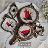 Decorative pendants with red cardinal designs. Silicone mold for making Christmas ornaments. Noel Elegance Mould by Redesign with Prima for Christmas