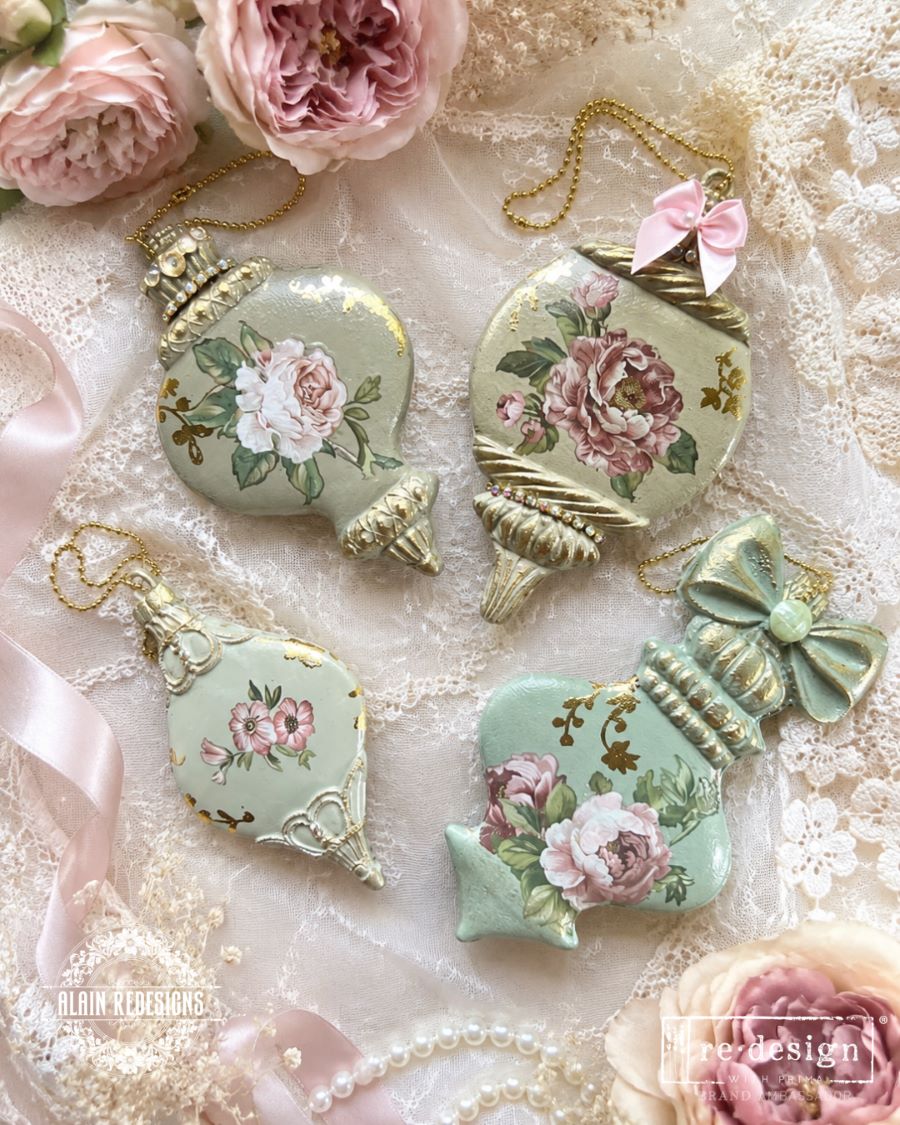 Decorative Christmas ornaments with floral designs on a lace background. Christmas Ornament mould set shown with the blank mold on the left and the cast  ornament pieces on the right. Winter Luxe Blanks Mould by Redesign with Prima