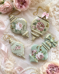 Decorative Christmas ornaments with floral designs on a lace background. Christmas Ornament mould set shown with the blank mold on the left and the cast  ornament pieces on the right. Winter Luxe Blanks Mould by Redesign with Prima