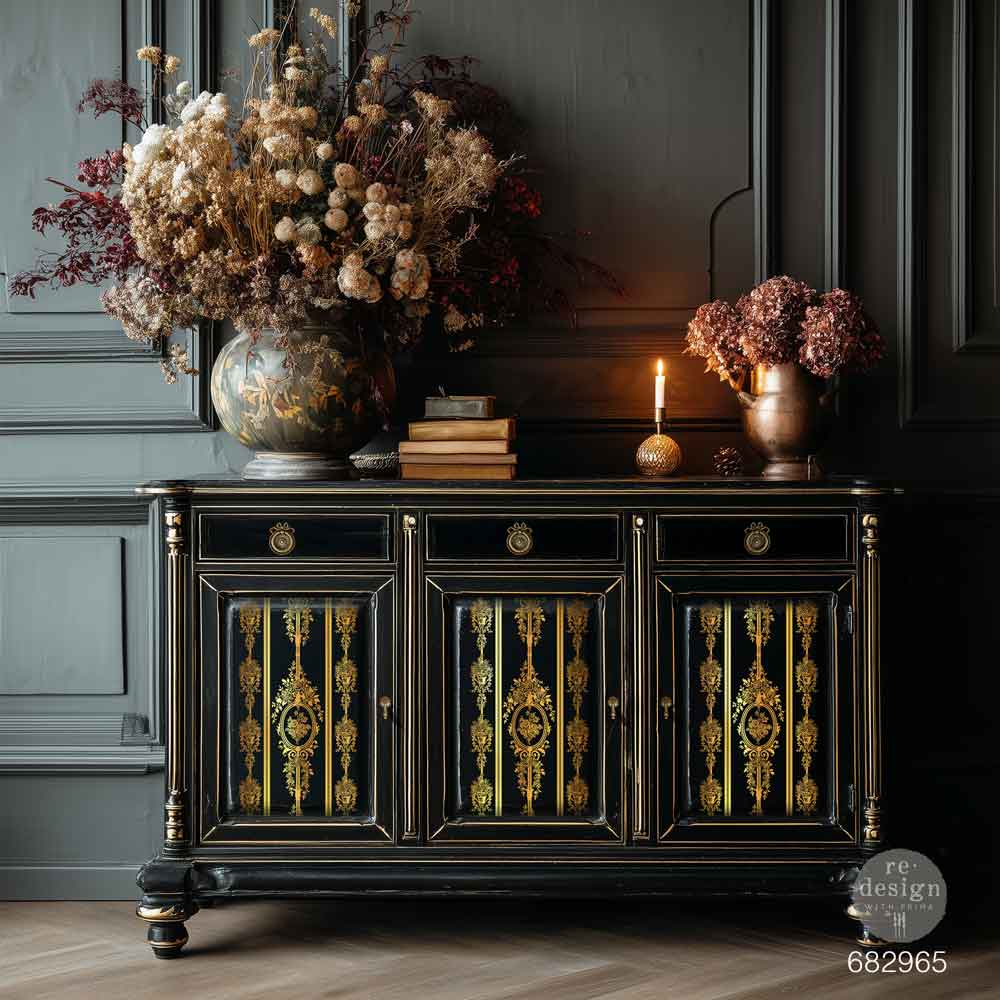 Decorative black cabinet with gold accents against a dark wall. Decorative gold pattern gold foil transfer. Redesign with Prima Christmas GOLD Chateau Filigree transfer Large KACHA 