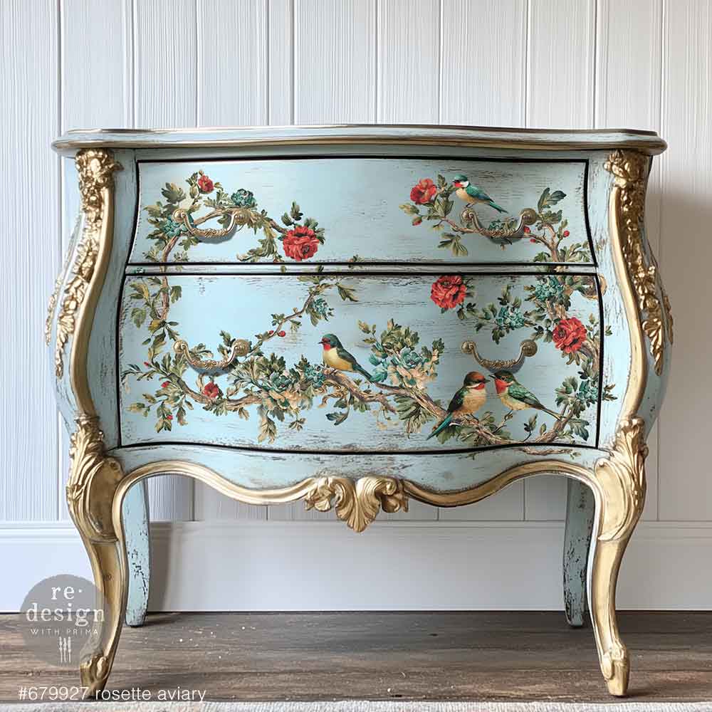 Redesign transfer Large Rosette Aviary. Decorative chest of drawers with floral and bird design on a white paneled wall.