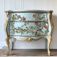 Redesign transfer Large Rosette Aviary. Decorative chest of drawers with floral and bird design on a white paneled wall.