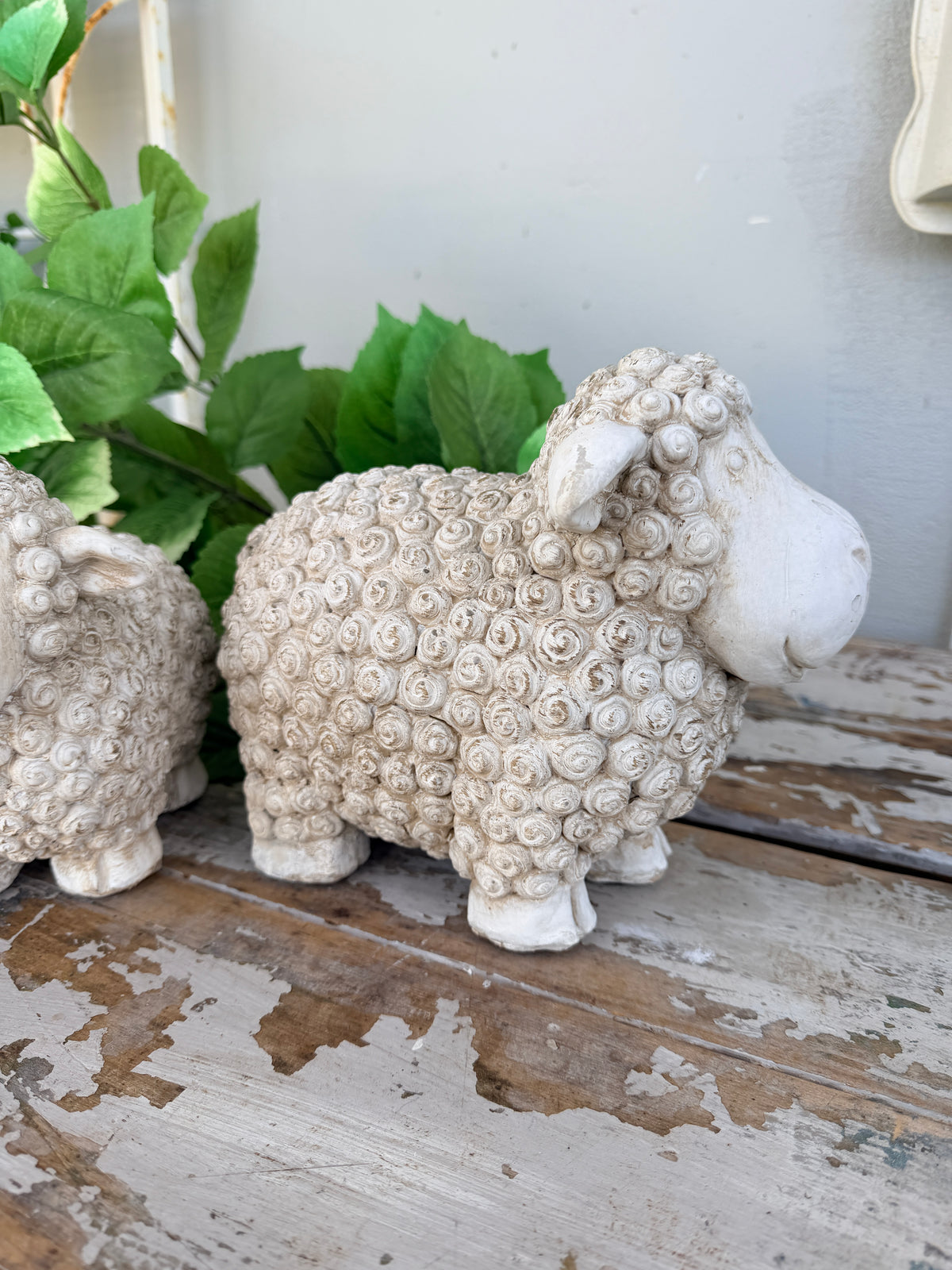 textured sheep figurine in a distressed off-white concrete finish
