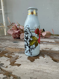 Painted glass mini milk bottle Blue w red and black floral