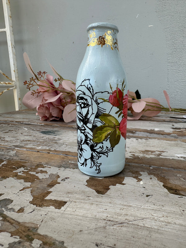Painted glass mini milk bottle Blue w red and black floral