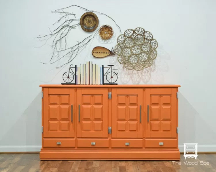 Orange cabinet with decorative items on a white wall, Tuscan Orange fusion mineral paint