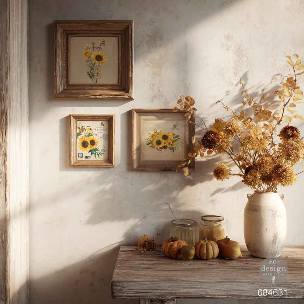 Decorative setting with framed sunflower prints and a vase of flowers on a wooden table. H2O transfer Rustic Amber Petals 1 sheet Redesign with Prima
