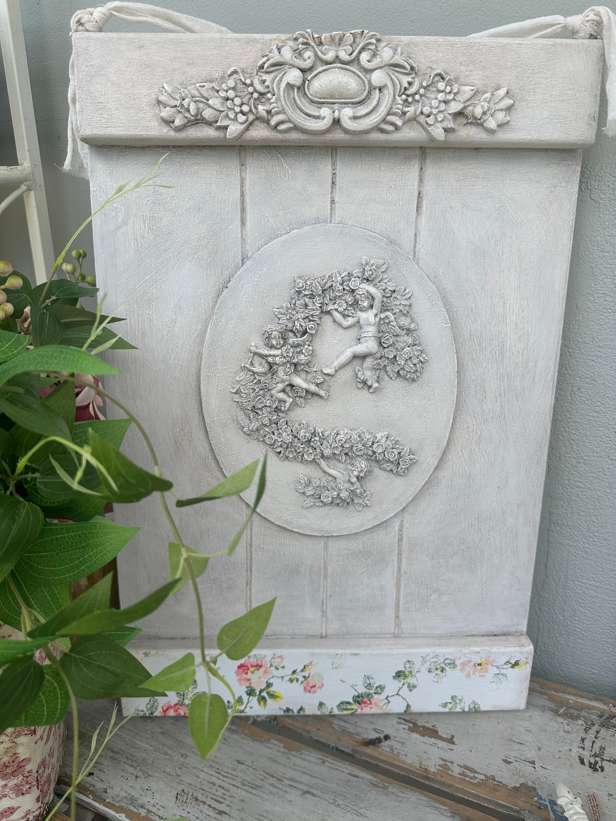 Cherubs wall hanging - painted ex the PMV studio