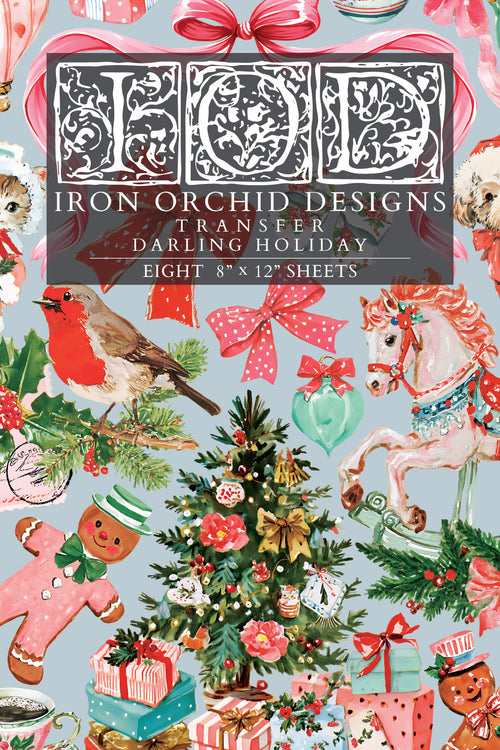 A Christmas-themed transfer sheet featuring a busy holiday pattern with a robin, carousel horse, ornaments, gifts, gingerbread men, bows, and a central title panel reading 'Iron Orchid Designs Transfer Darling Holiday' and 'Eight 8" x 12" sheets'.