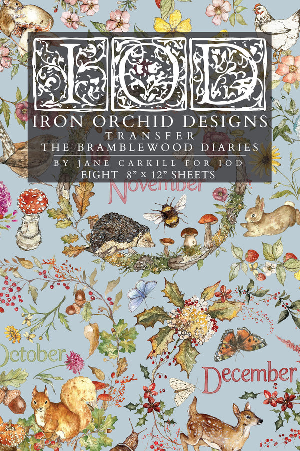 A flat lay of a transfer paper sheet featuring autumn and woodland illustrations, labeled 'IOD Iron Orchid Designs Transfer The Bramblewood Diaries' 