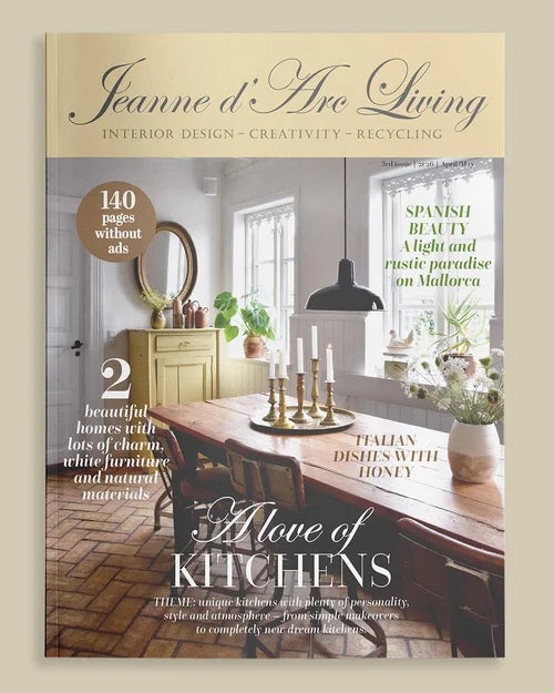 Magazine cover of 'Jeanne d'Arc Living' featuring a dining room with wooden table and decor.